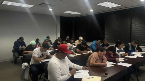 Diverse students engaged in focused learning activities inside a modern classroom setting.